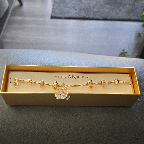 Anne Klein Jewelry - Anne Klein Gold-Tone Heart Charm Bracelet with Crystal Pavé